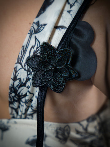 Black Floral Sheer Attachable Sleeves with fasteners.