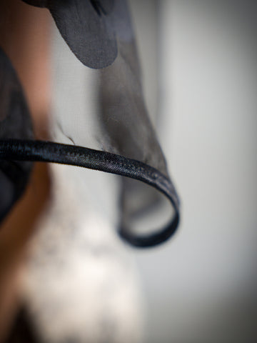 Black Floral Sheer Attachable Sleeves with fasteners.