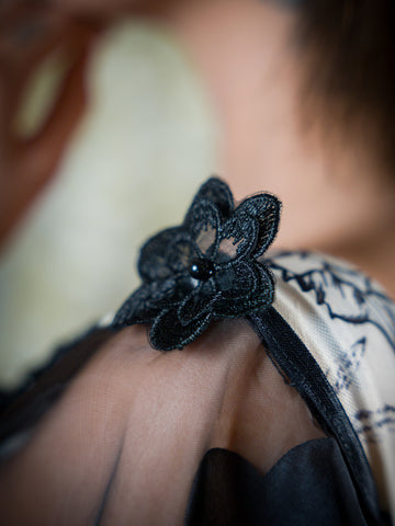 Black Floral Sheer Attachable Sleeves with fasteners.